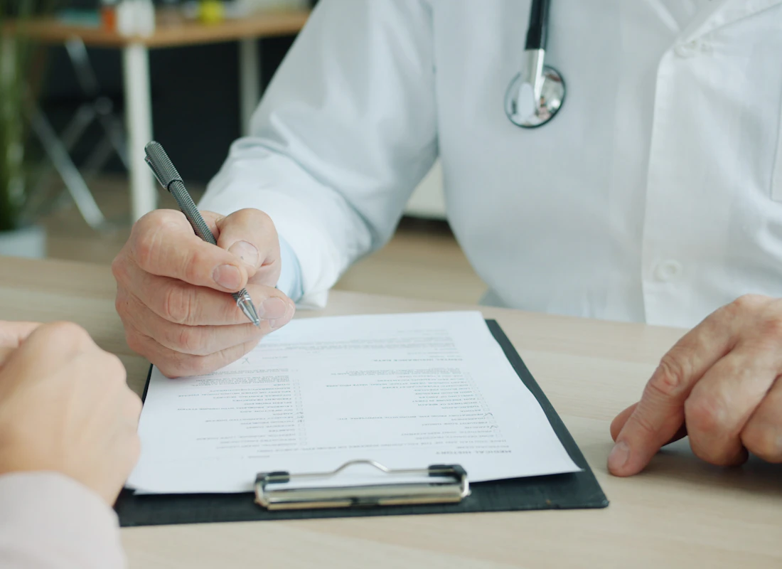 Physician reviewing practice documentation